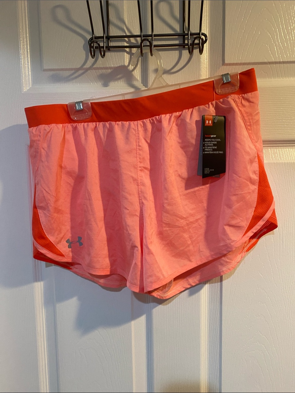 Under Armour Women's Coral Pink Athletic Shorts with Orange Waistband